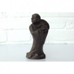 Bronze monk ith his alms bowl