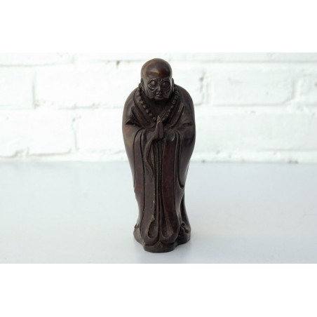 Bronze monk in meditation