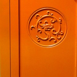 Orange colour cabinet with dragons
