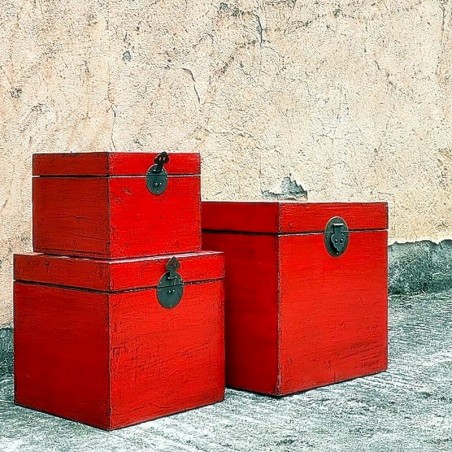 Nest of three red lacquered trunks