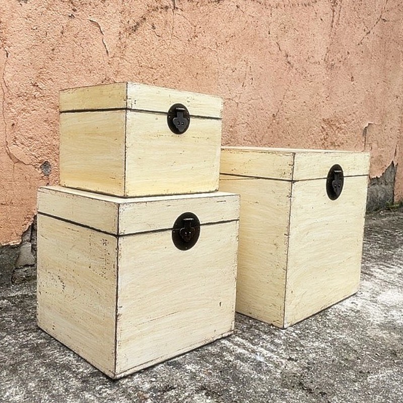 Nest of three ivory lacquered trunks