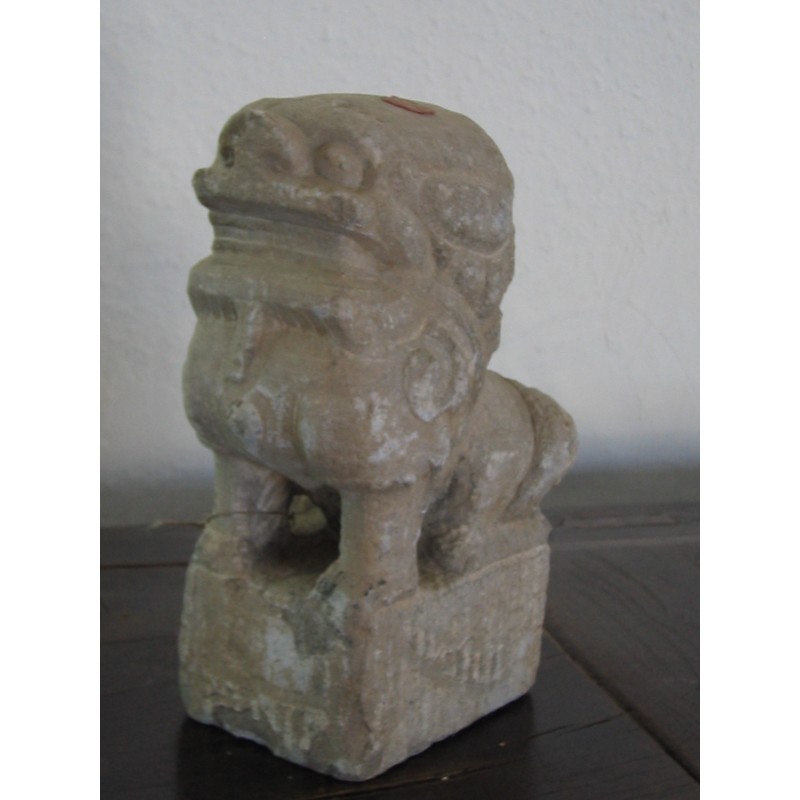 Chinese guardian lion in natural stone